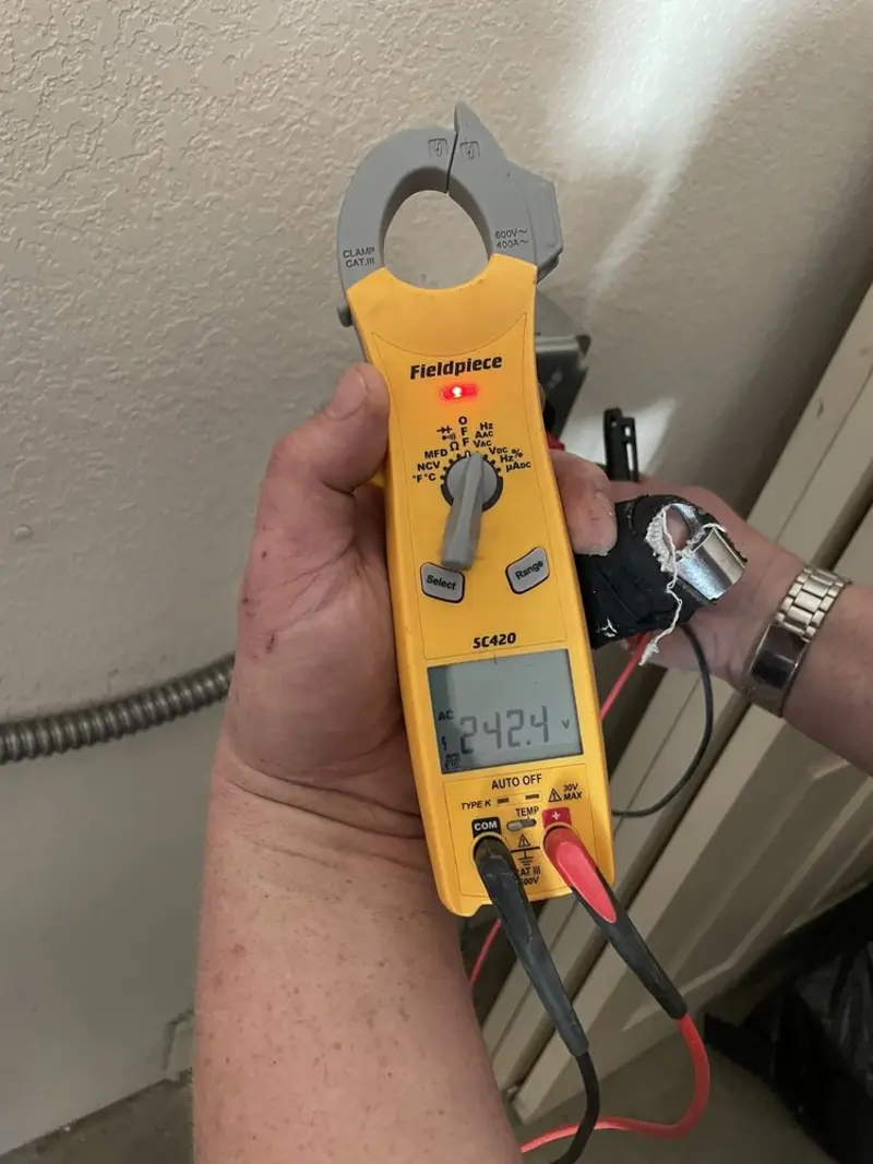 Voltage testing with clamp meter during Electrical Installation Services in Tiverton